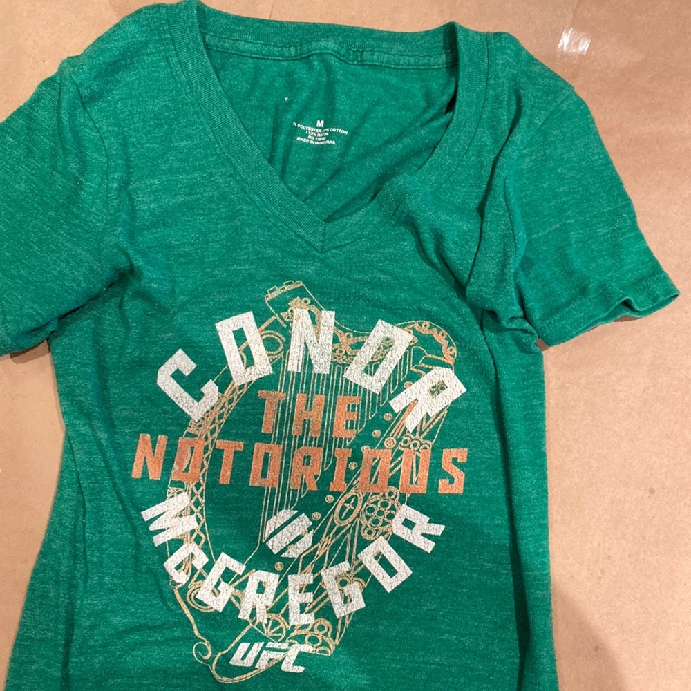 Medium sized Conor McGregor UFC tee. Green with logo on front.
